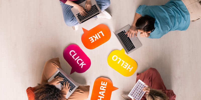 Social media addiction Above view of young people sitting and lying on floor with internet activity tags and using modern portable devices, social media addiction concept
